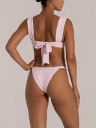 Side-back view of mint green bikini bottom featuring high waist and wide waistband