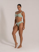 Front view of mint textured bikini set featuring a twist-front top and sculpted fit