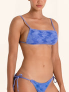 Women’s blue bikini top featuring tie dye print and adjustable straps.