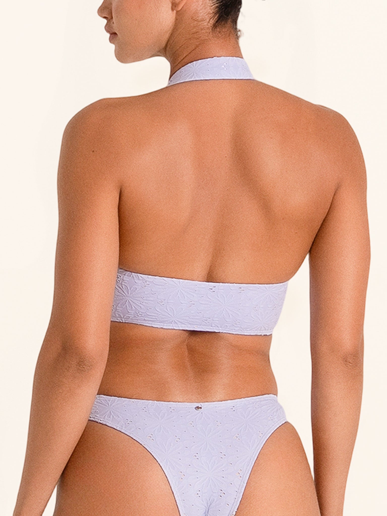 Women’s lilac swim top featuring chic cutout design.