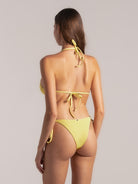 Back view of yellow triangle bikini top with tie closure and textured swim fabric
