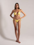 Front view of yellow textured triangle bikini with tie-side bottoms