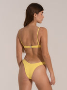 Back view of a yellow V-neck bikini top with adjustable straps and clasp closure